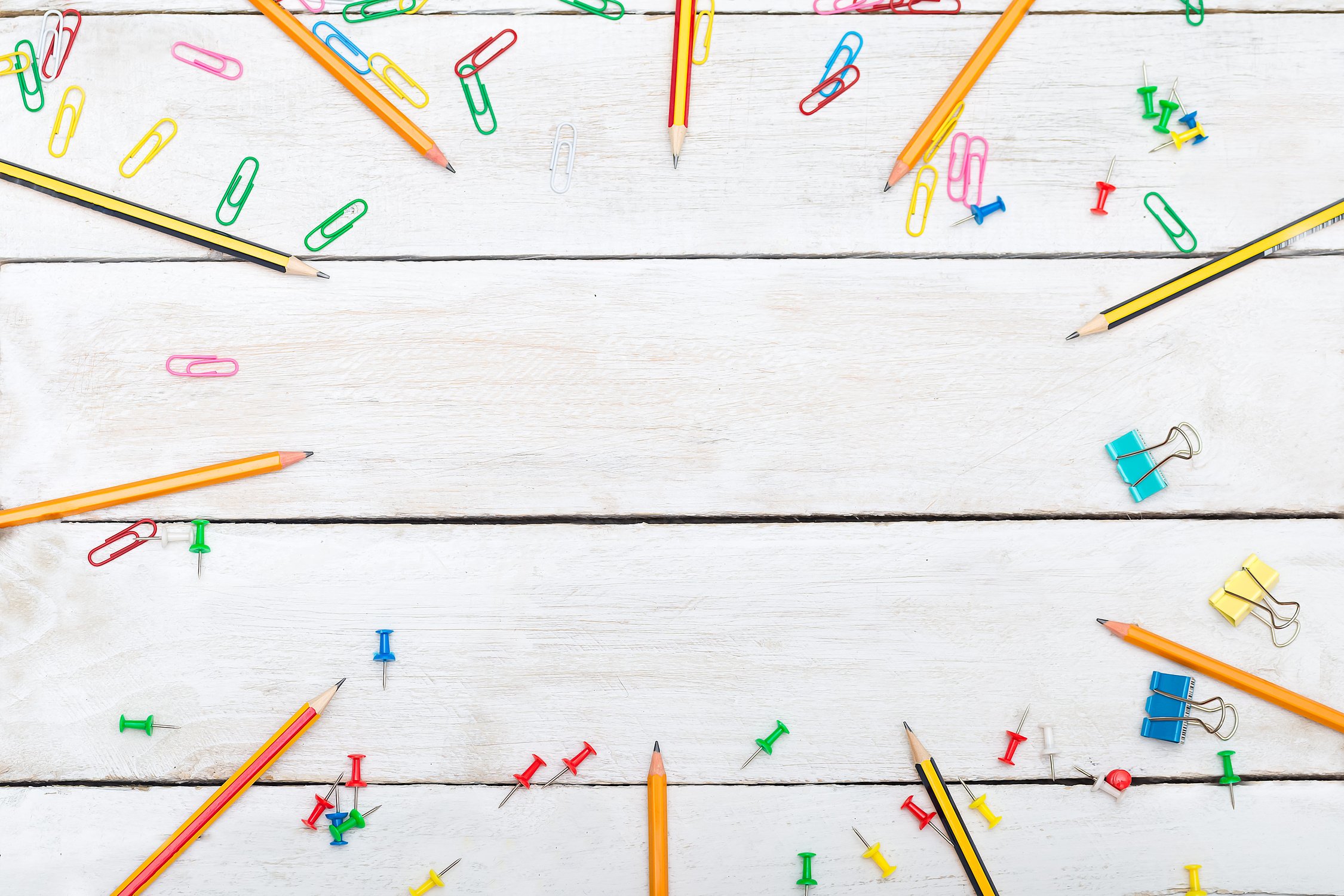 School supplies on white wooden background. Back to school.